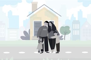 A happy family, rendered in grayscale, stands huddled together on a street in front of their house. The father wears dark trousers and a textured shirt, his arm around his smiling daughter who clings to his leg. He has his other arm around his wife, who has a beautiful patterned dress. She in turn embraces their young son, who stands beside her looking up and smiling. Behind them is a simple yellow-painted house with a dark blue front door and a window, with a chimney and small tree. In the distance is the skyline of a city, with numerous skyscrapers stretching across the horizon under a cloudy sky. The scene is presented in a charming vector art style, full of character.