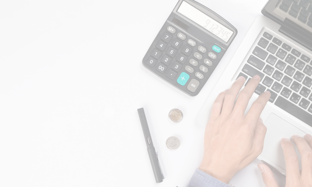 Calculator, hand typing on laptop's keyboard